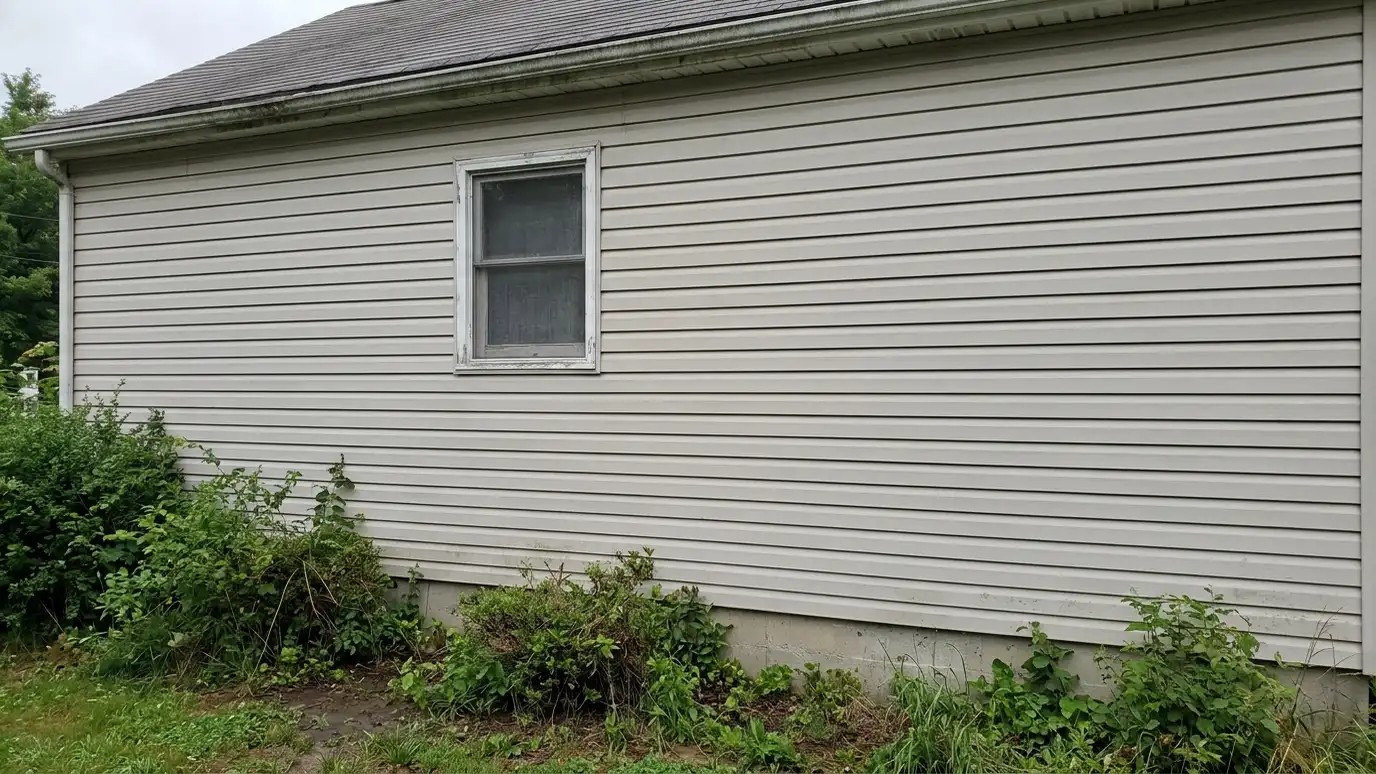 Before: a cottage front wall with a small dated flat window on plain vinyl siding